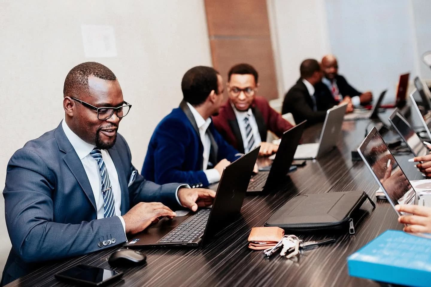 The Uptech Consulting team working together at a boardroom table